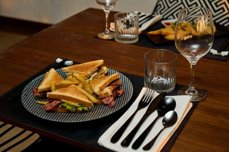 Club sandwich and fries in the evening light